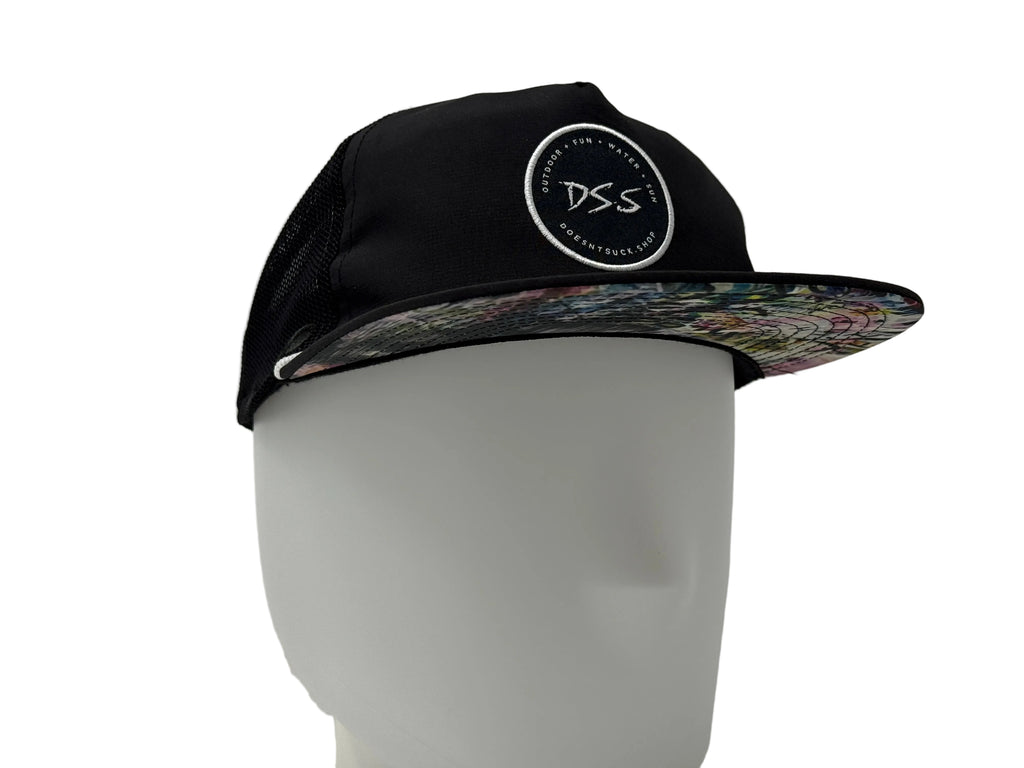 Black cap with a colorful bill on a mannequin head against a gray background
