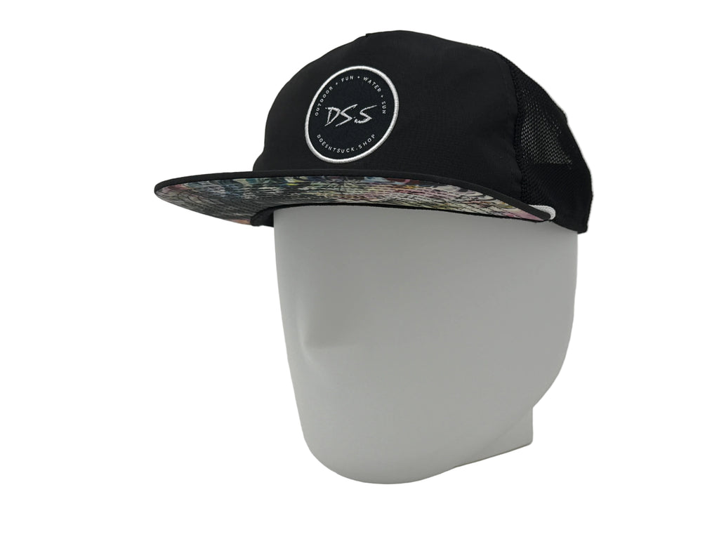 Black cap with floral brim and 'DS.S' logo on a white mannequin head against a white background