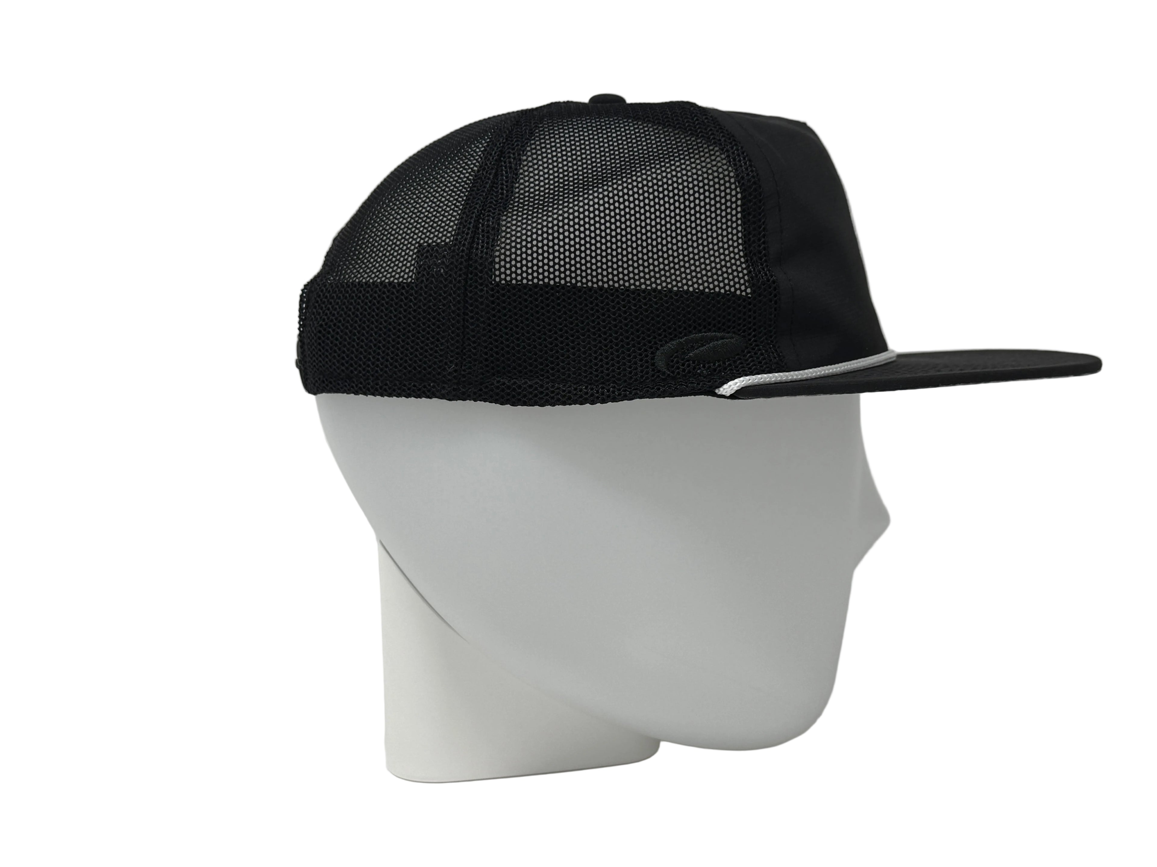 Black mesh cap on a white mannequin head against a light gray background