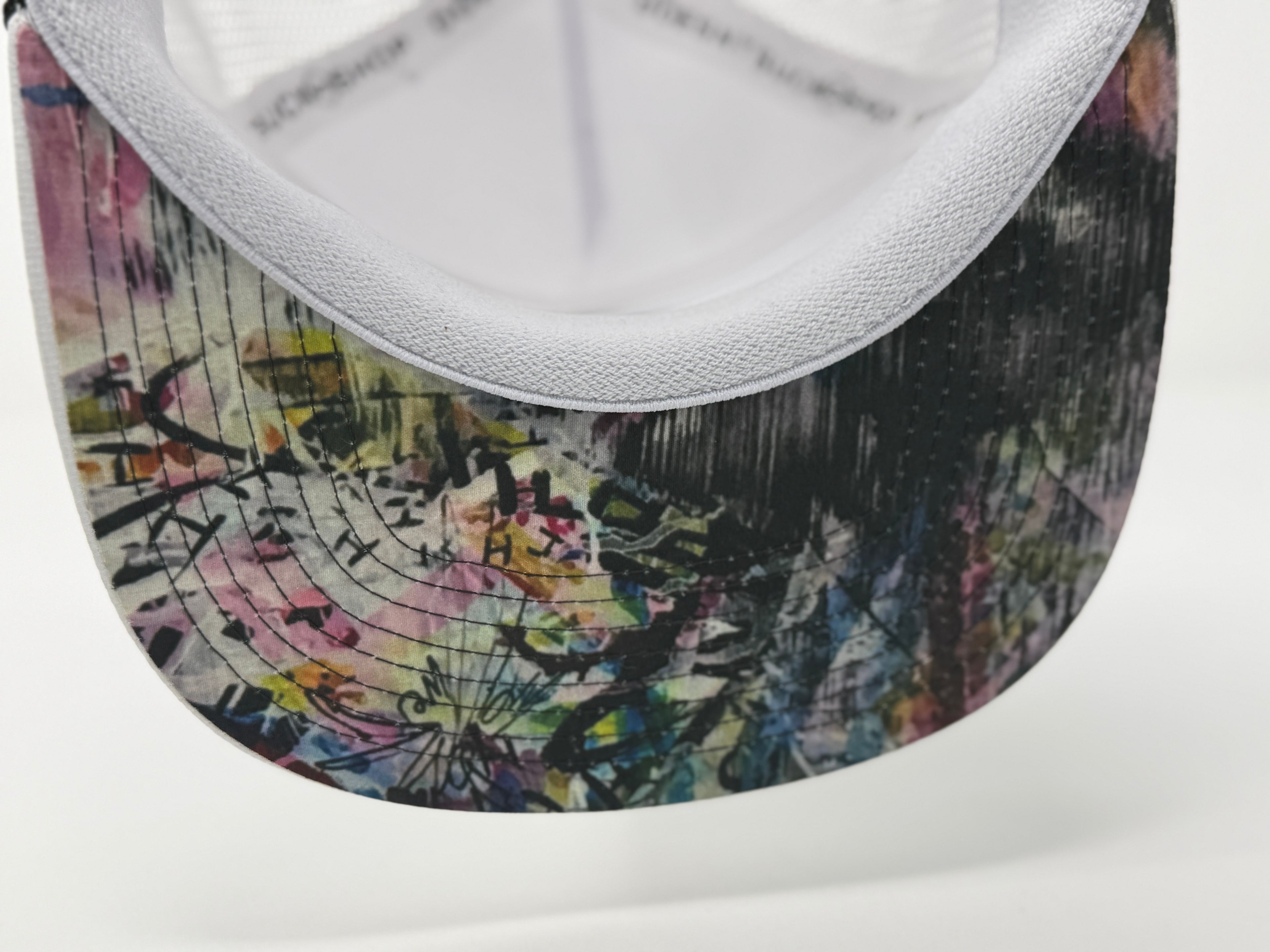 Close-up of a sneaker with a colorful abstract pattern on the side