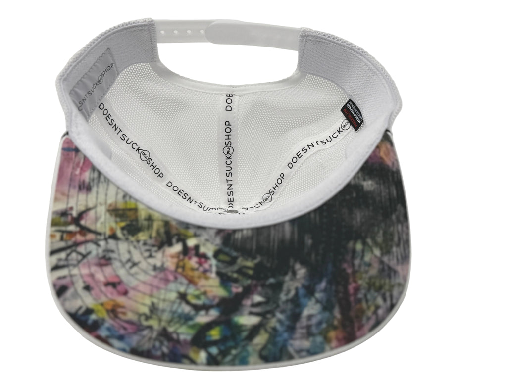 Visor with colorful pattern and white adjustable strap on a light gray background