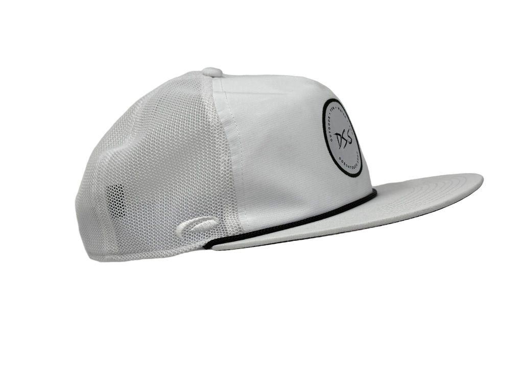 White cap with a black logo on a gray background
