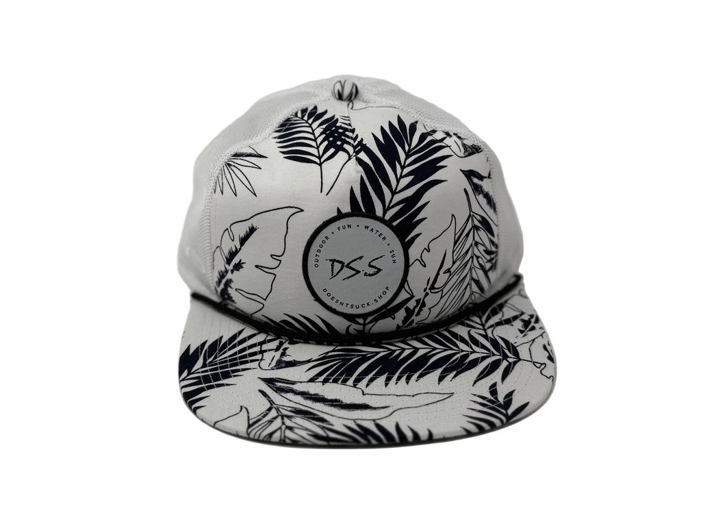 White cap with black leaf pattern and 'DS.S' logo on a white background