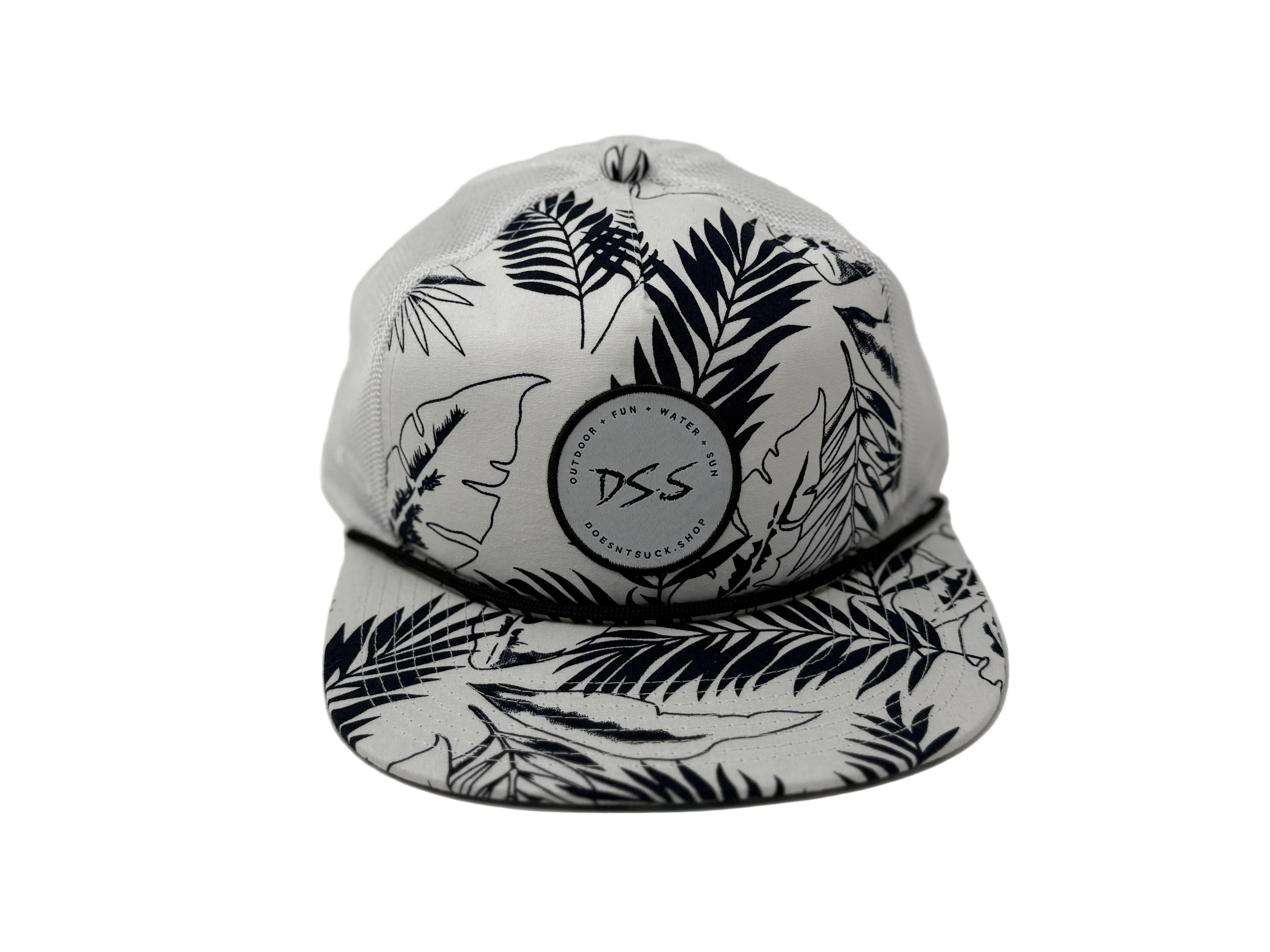 White cap with black leaf pattern and 'DS.S' logo on a white background