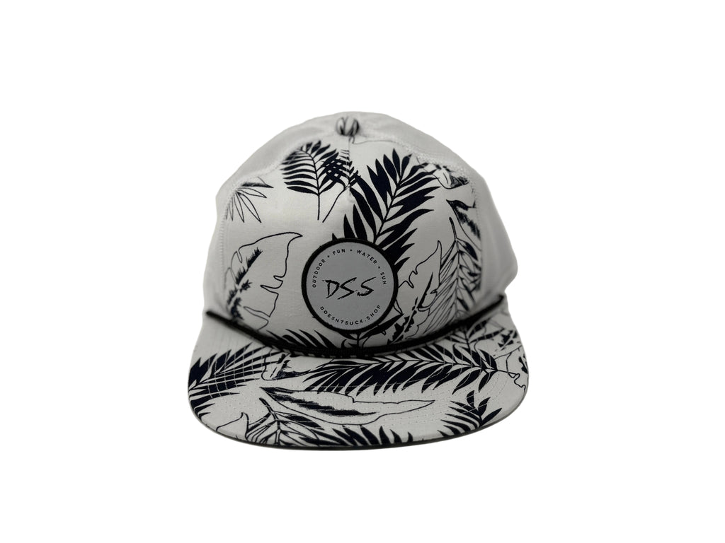 White cap with black leaf pattern and 'DSS' logo on a white background