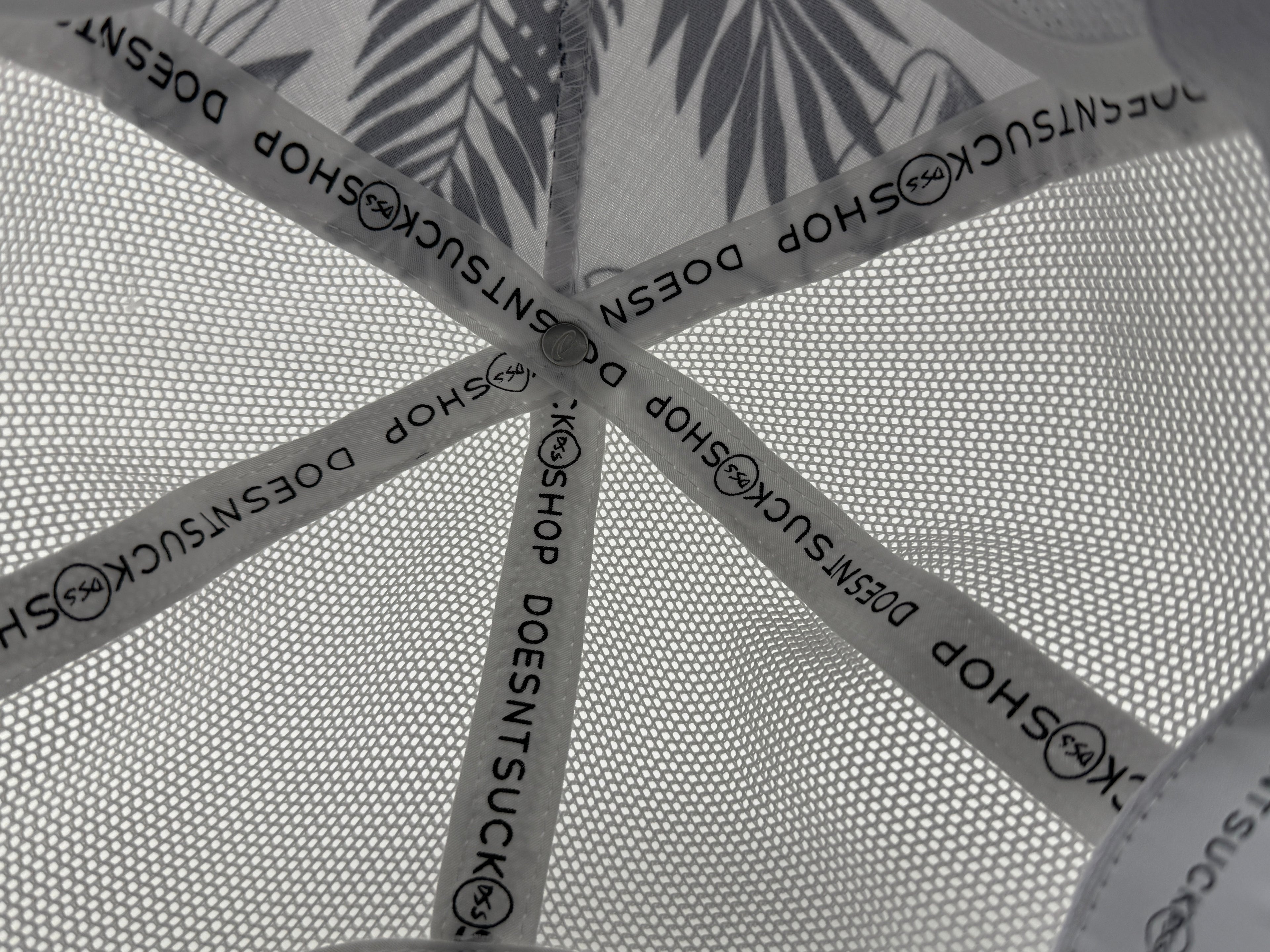 Textured surface with 'Doesnt Suck Shop' branding.