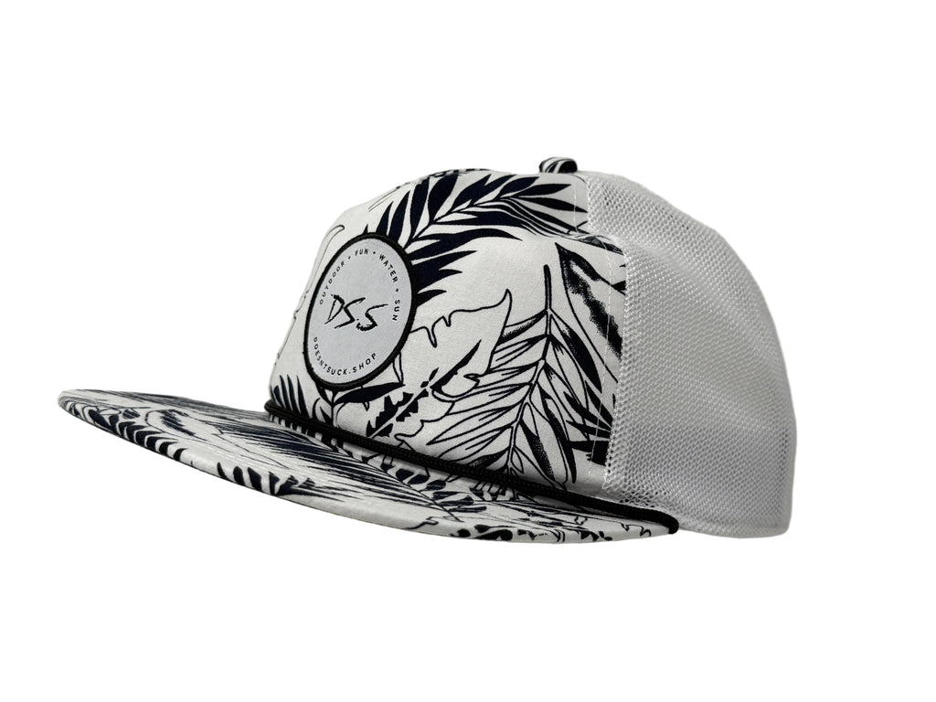 Black and white patterned cap with a brand logo on a gray background