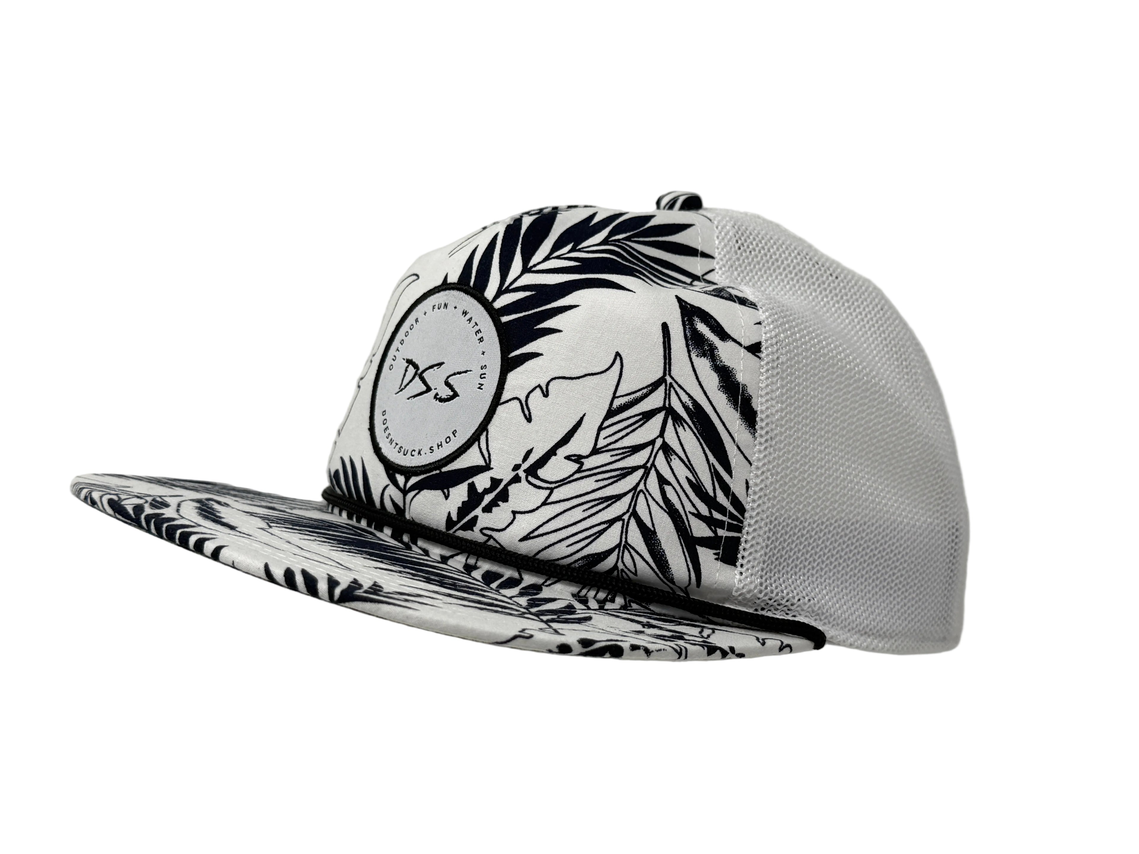 Black and white patterned cap with a brand logo on a gray background