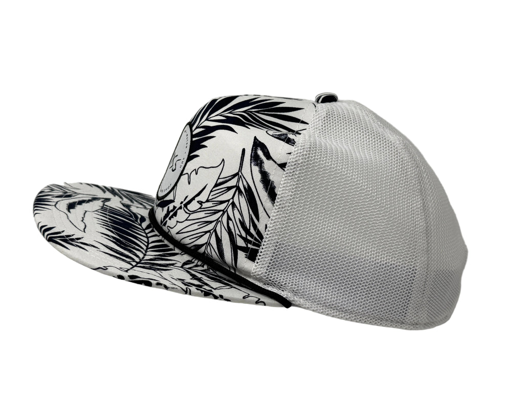 Trucker hat with black leaf pattern on a white background