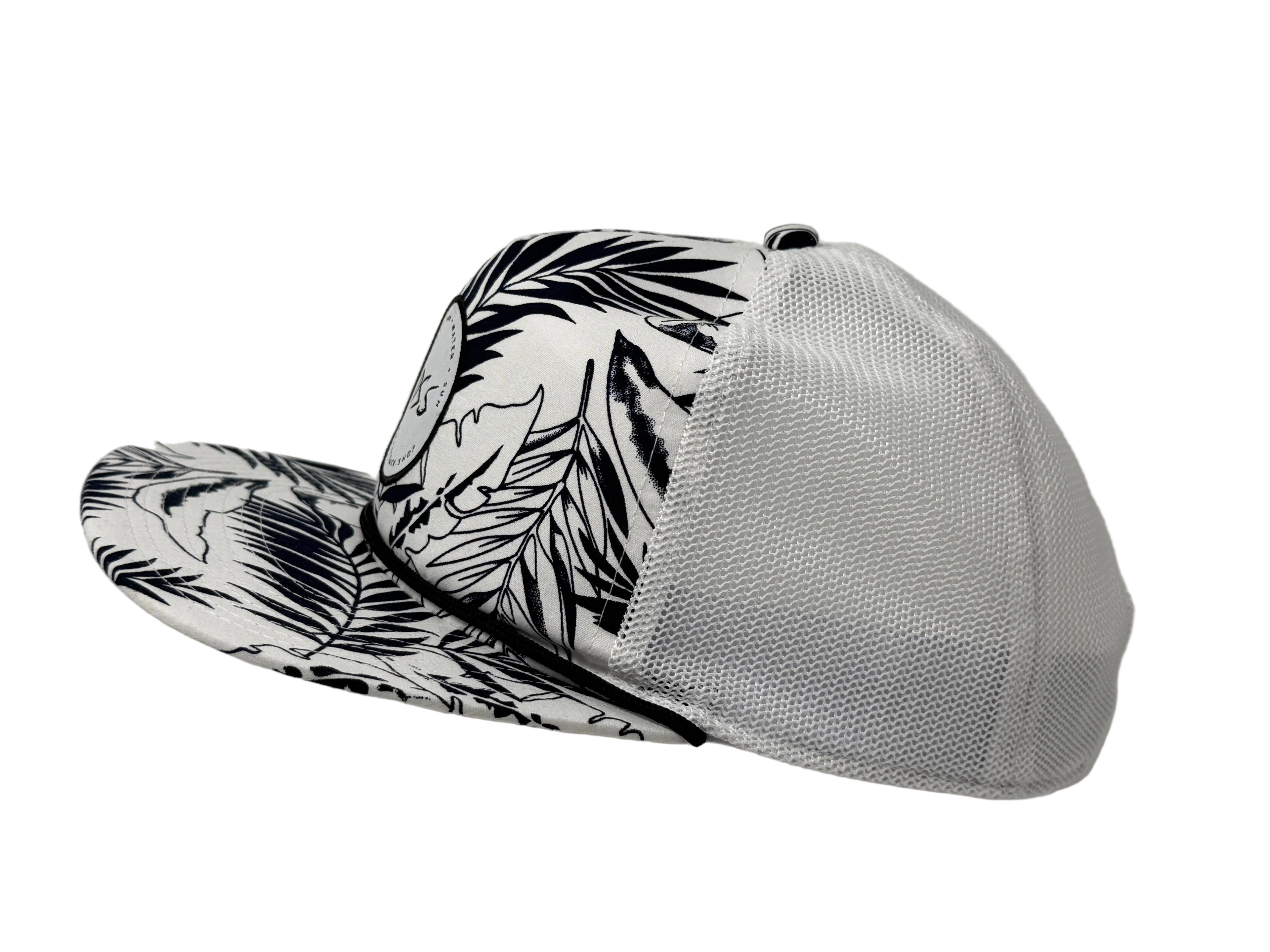 Trucker hat with black leaf pattern on a white background