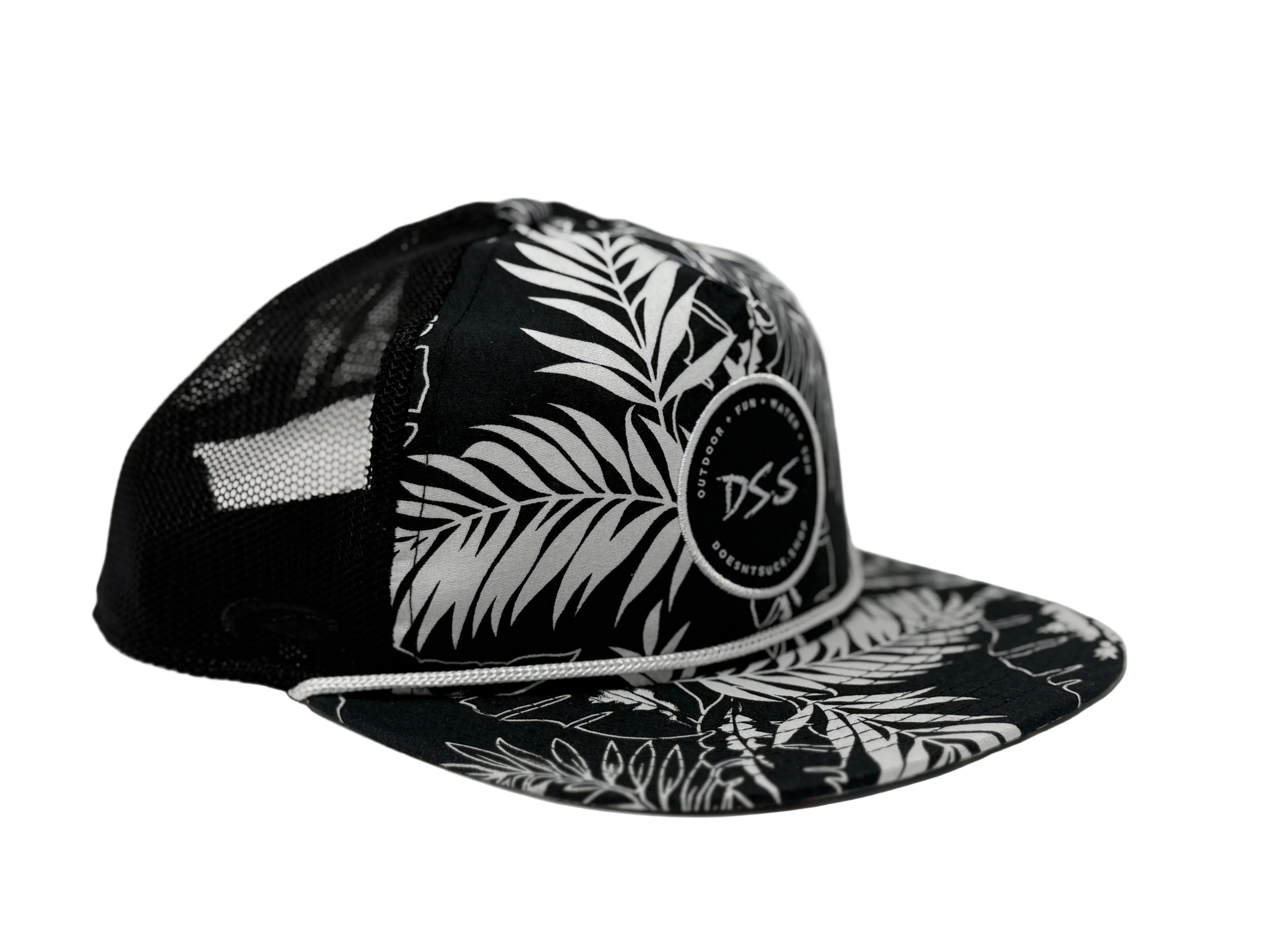 Black and white cap with leaf pattern and 'DSS' logo on a light gray background