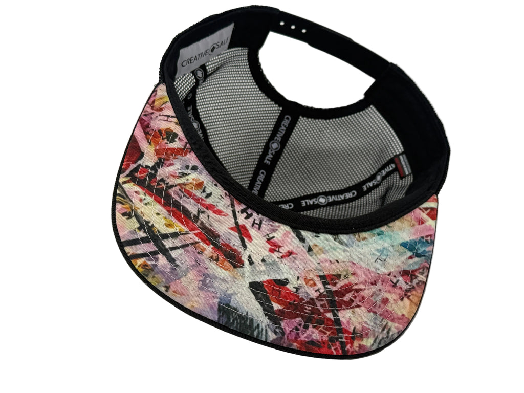 Colorful patterned visor cap on a white background