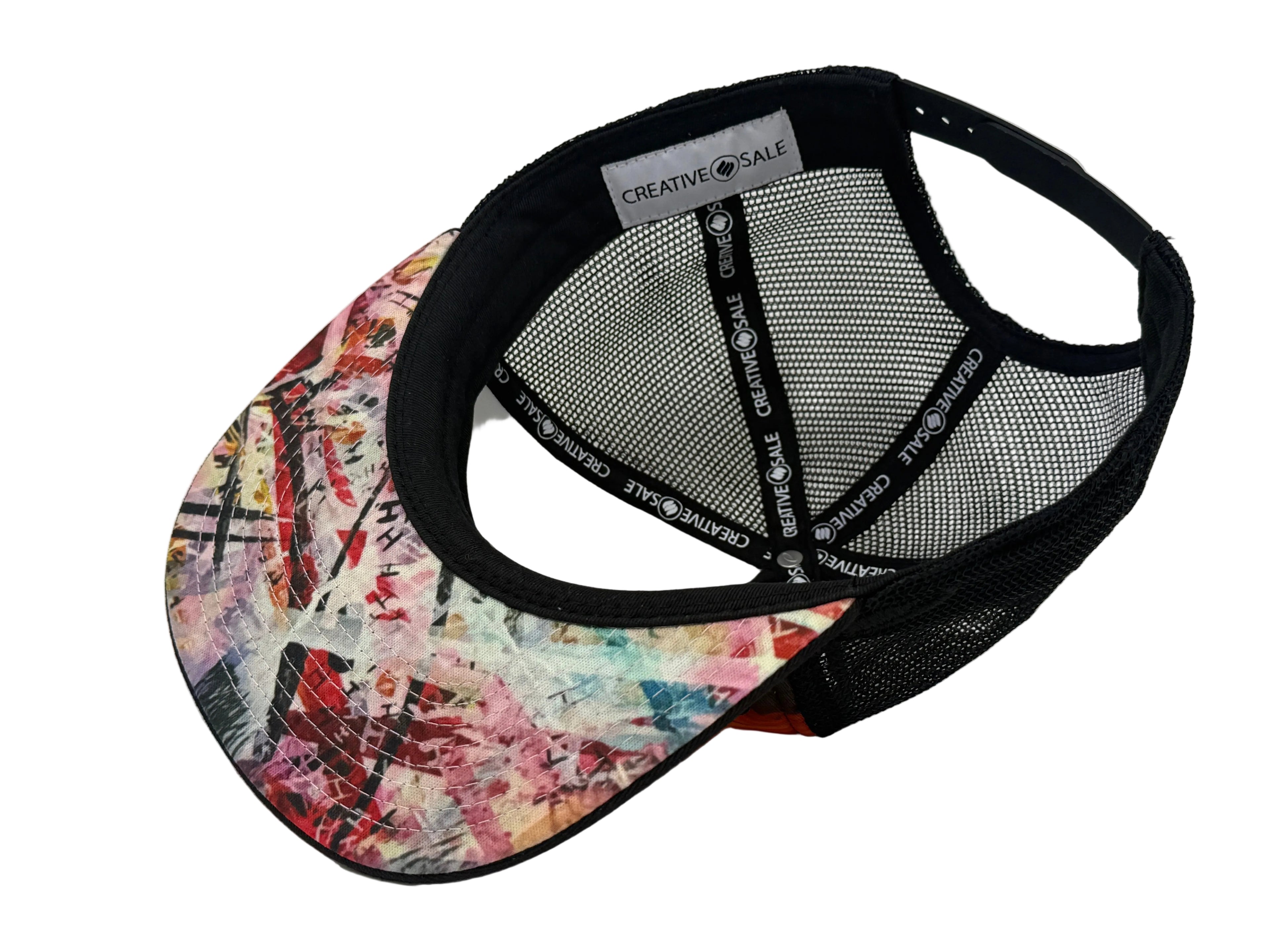 Colorful cap with a pattern on the front and black mesh back on a white background