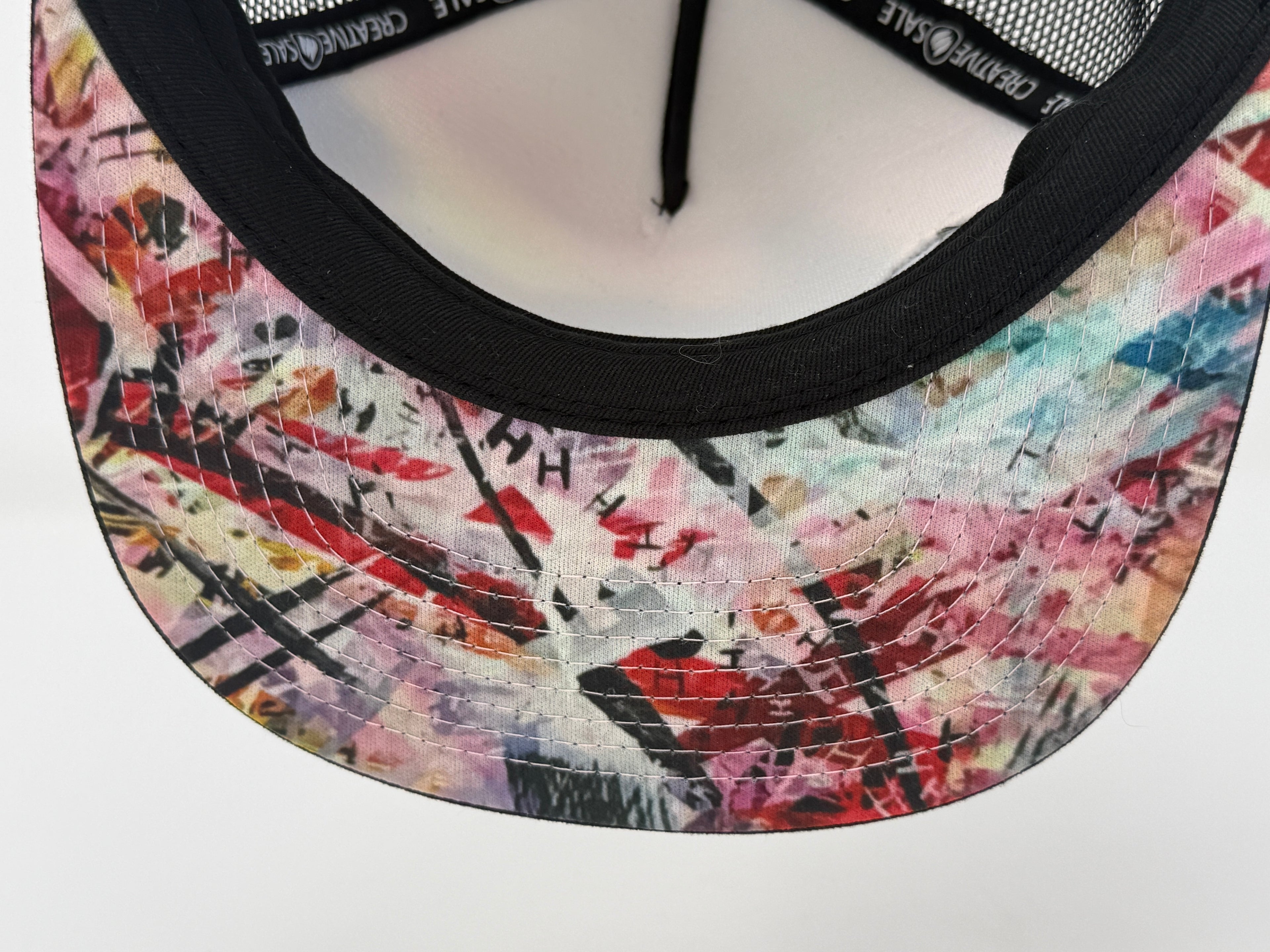 Colorful patterned visor on a white background