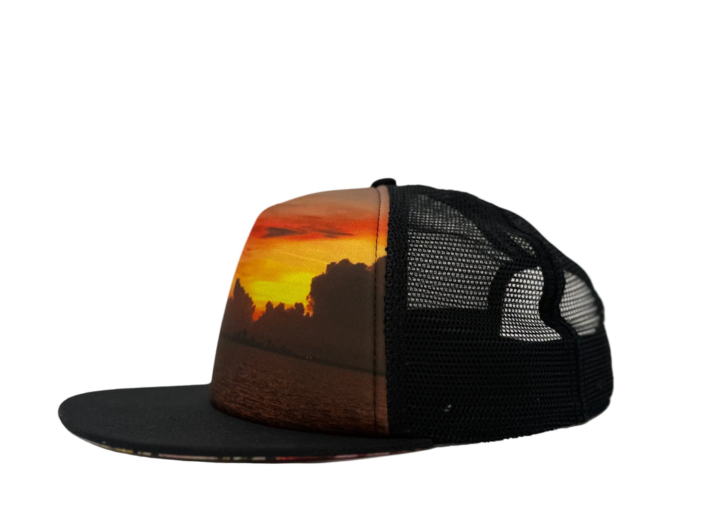Black mesh cap with a sunset design on a white background