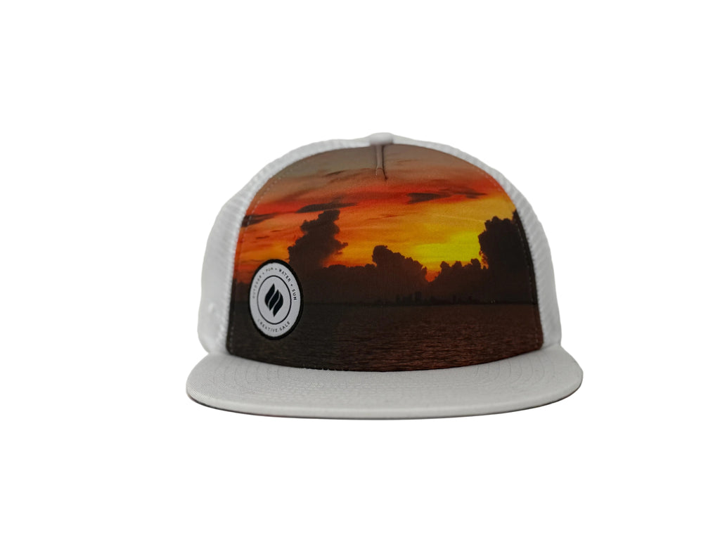 Cap with sunset design and logo on a white background