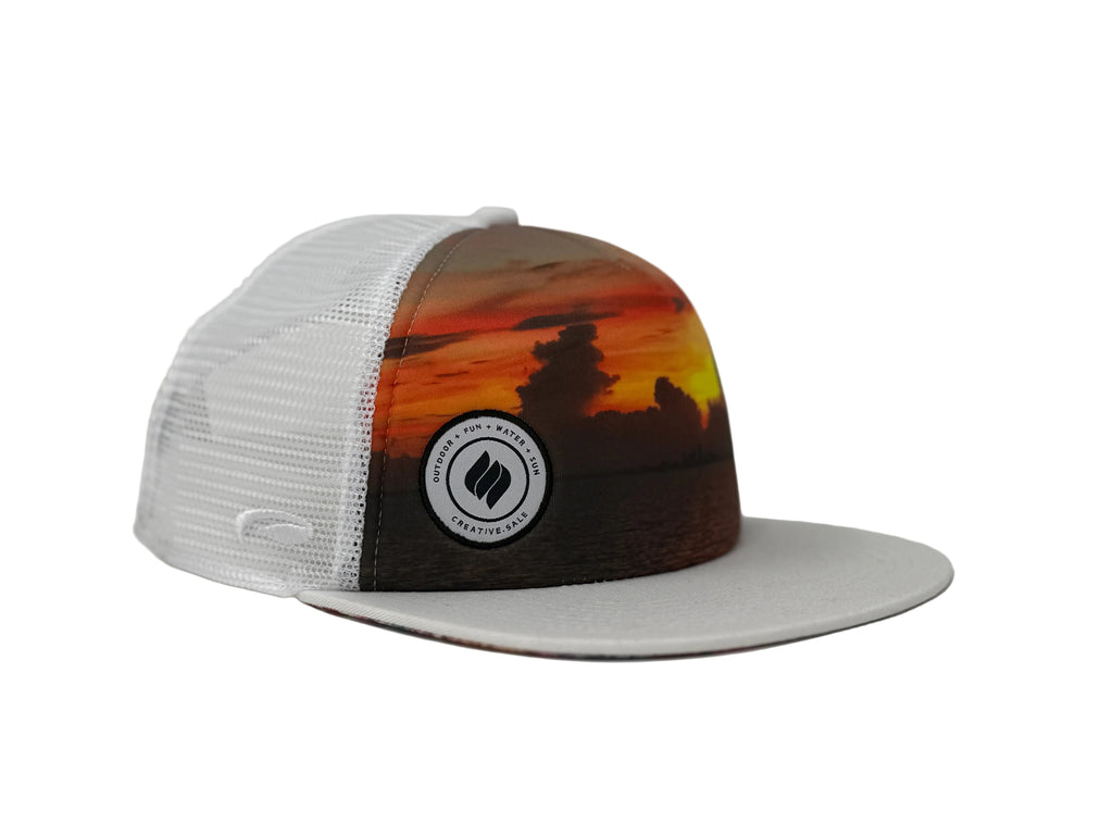 Trucker hat with a sunset design and white mesh back on a gray background
