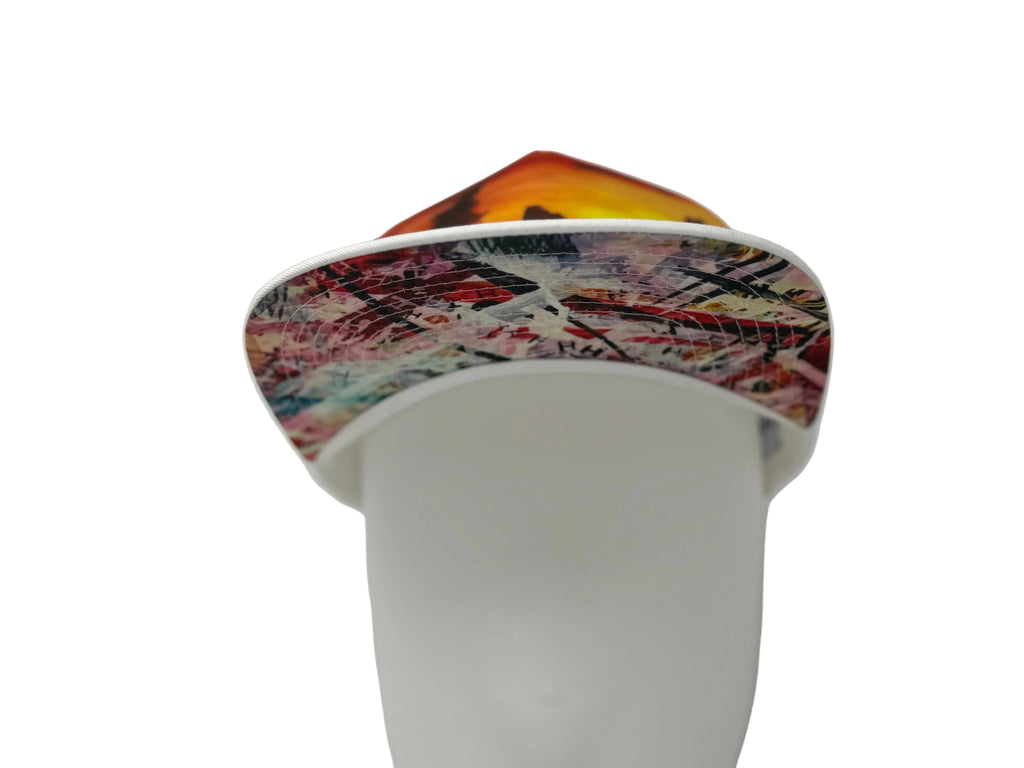 Colorful geometric-patterned ring on a white background