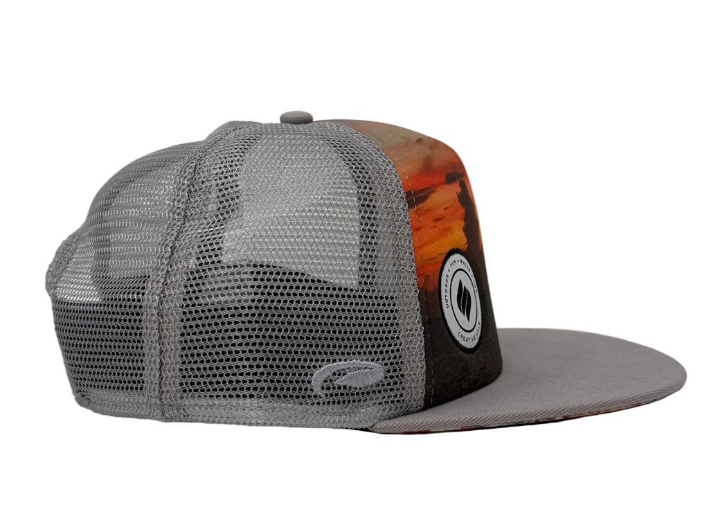 Trucker hat with mesh back and colorful front panel on a white background