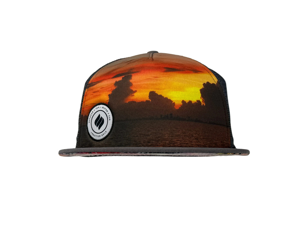 Charcoal Cap with sunset design and logo on a white background