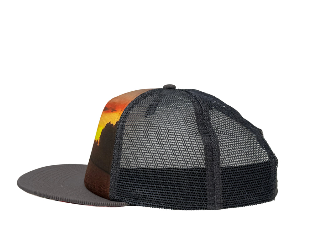 Charcoal mesh cap with a scenic design on a gray background
