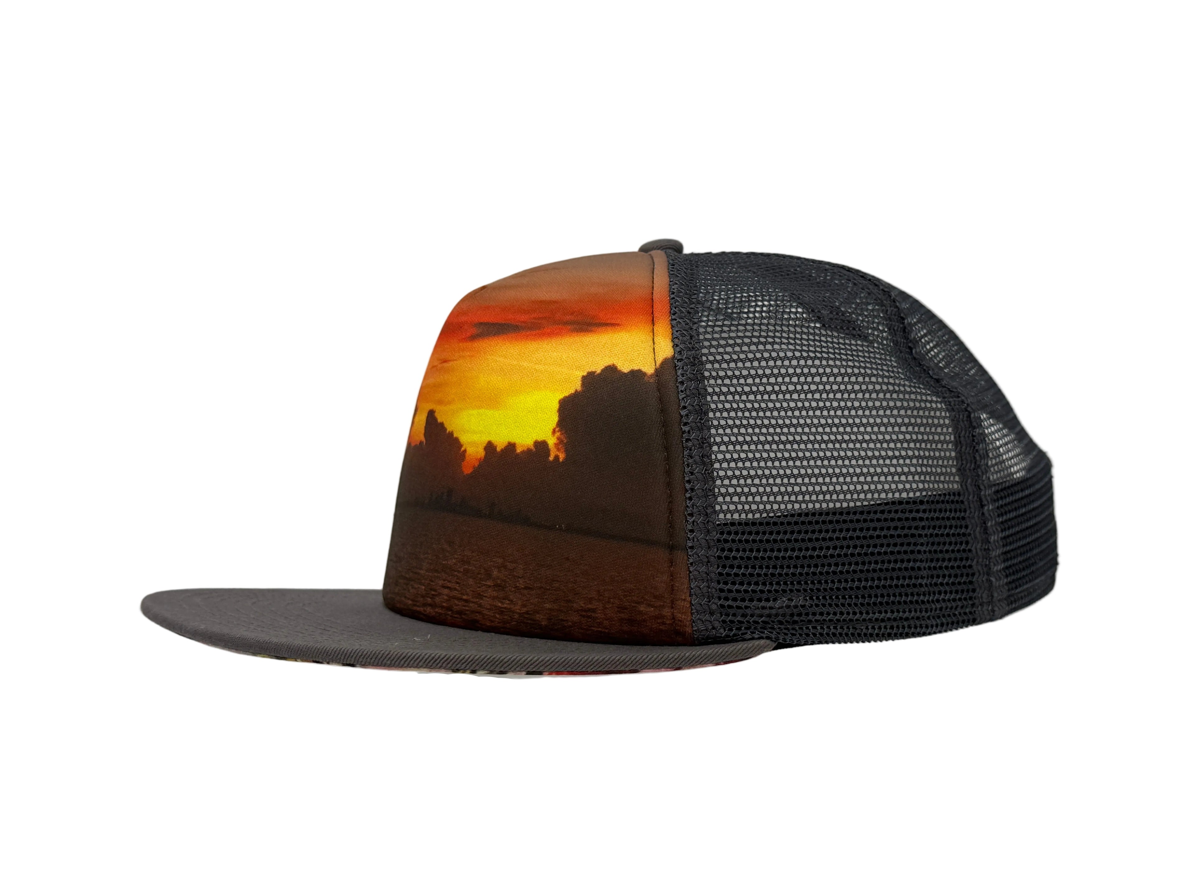 Charcoal Trucker hat with a sunset design on a white background