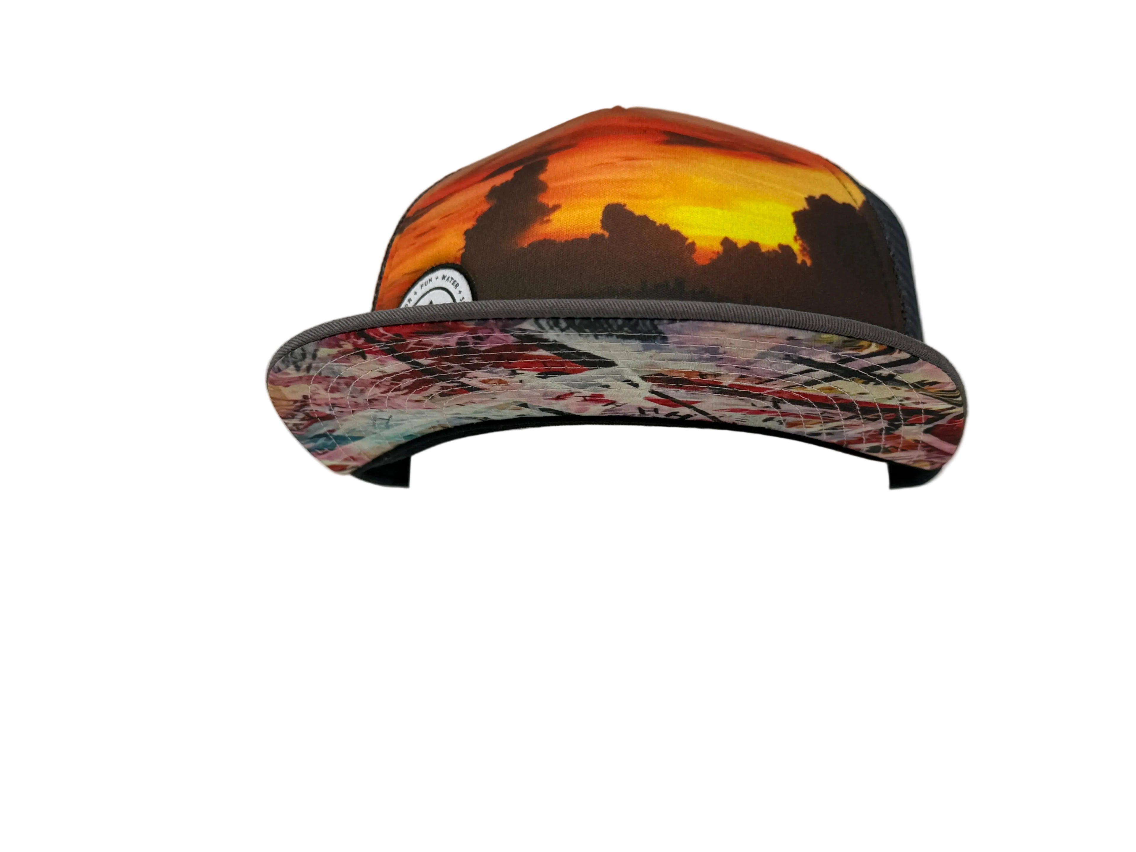 Charcoal Cap with a sunset design on a mannequin head against a white background