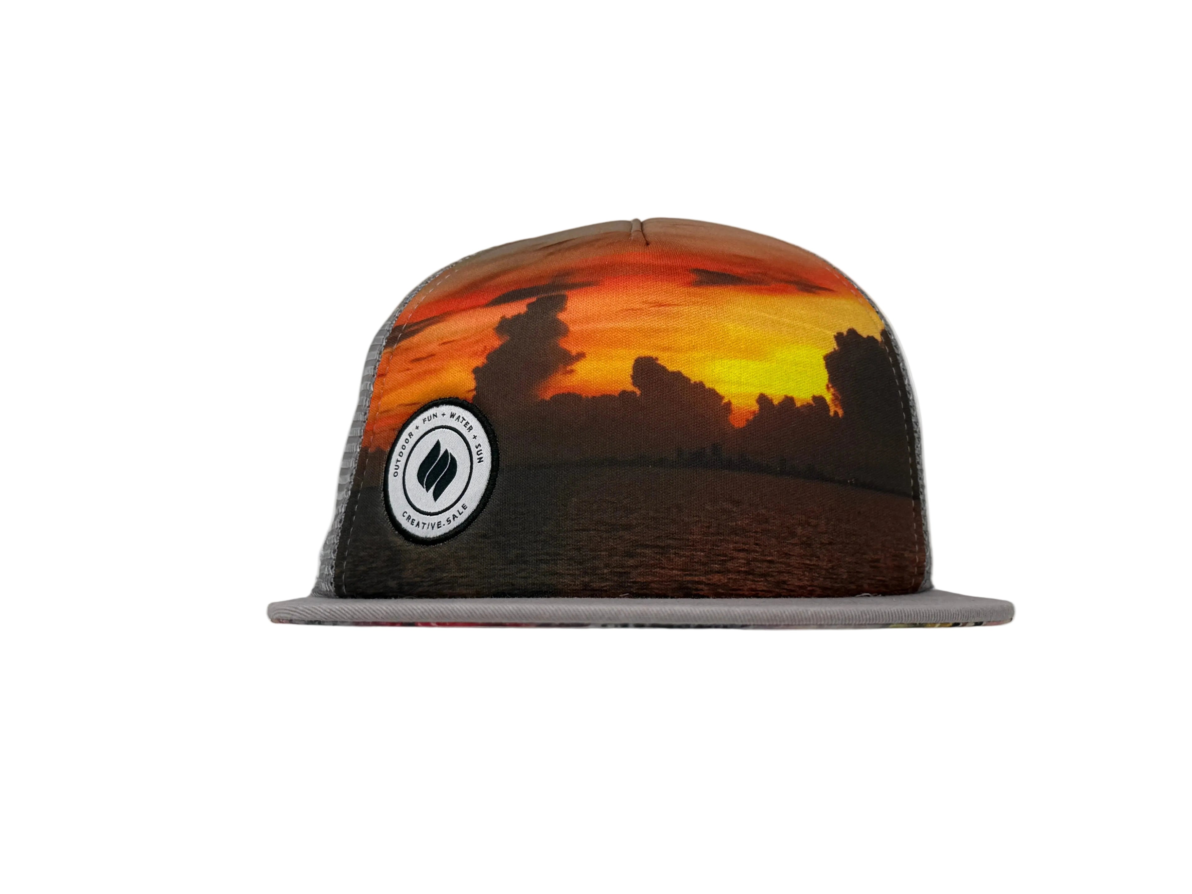 Trucker hat with sunset design and logo on a white background